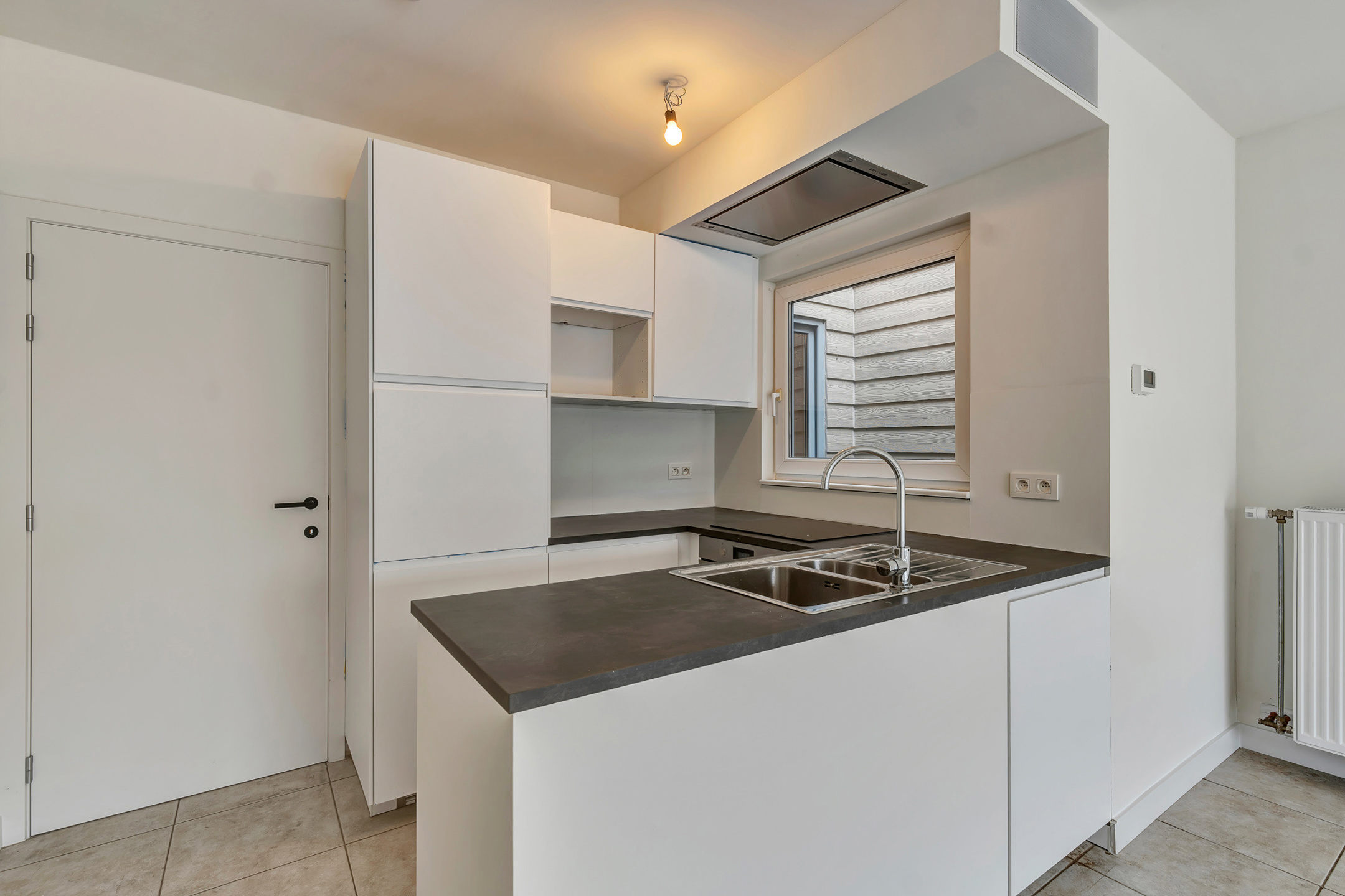 Instapklaar gelijkvloers appartement met tuin nabij centrum - foto 2