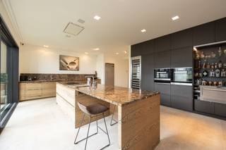 <p><span>Exclusive apartment of approx. 198 m² with spacious terrace of approx. 35 m² located in the special residential concept "The Channel".</span></p><p><span> </span></p><p><span>Layout</span></p><p><span>You enter the apartment through the entrance hall with guest toilet and checkroom, access to an office with gas fireplace and then access to a spacious and bright living room also equipped with a gas fireplace and sliding doors with access to a spacious terrace of approx 35 m². Both from the living room and the entrance hall you have access to the spacious and high quality finished kitchen with a cooking island, natural stone countertops and various appliances. Practical laundry room/utility room with connections for washer and dryer. </span></p><p><span>Through a common dressing room there is access to a master bedroom with parquet flooring, ensuite bathroom with bath, walk-in shower, toilet and double sink. Second bedroom also with ensuite bathroom.</span></p><p><span> </span></p><p><span>Details</span></p><p><span>This luxury apartment was finished with attention to detail!  Durable and high quality materials were used during the renovation/new construction in 2015. The living area is approximately 198 m², the terrace has an area of approximately 35 m². Heating by underfloor heating, central heating on natural gas. Extensive alarm system, camera surveillance, air conditioning in the master bedroom. </span></p><p><span> </span></p><p><span>Possibility to enlarge the apartment</span></p><p><span>There is a possibility to buy the adjacent apartment in order to realize a full floor to one unique apartment! This creates an apartment of approx 346m² and more than 60m² terraces!</span></p><p><span> </span></p><p><span>Parking and storage</span></p><p><span>Two car parking spaces are available in the underground parking basement. Possibility to purchase basement storage (additional cost of 14,000 euros).</span></p><p><span> </span></p><p><span>The canal</span></p><p><span>A unique living experience created by Axel Vervoordt in the former brewery and malt house on the canal near Wijnegem. Find out more about this special project on the Het Kanaal website.</span></p><p><span> </span></p><p><span>More information through our office.</span></p>