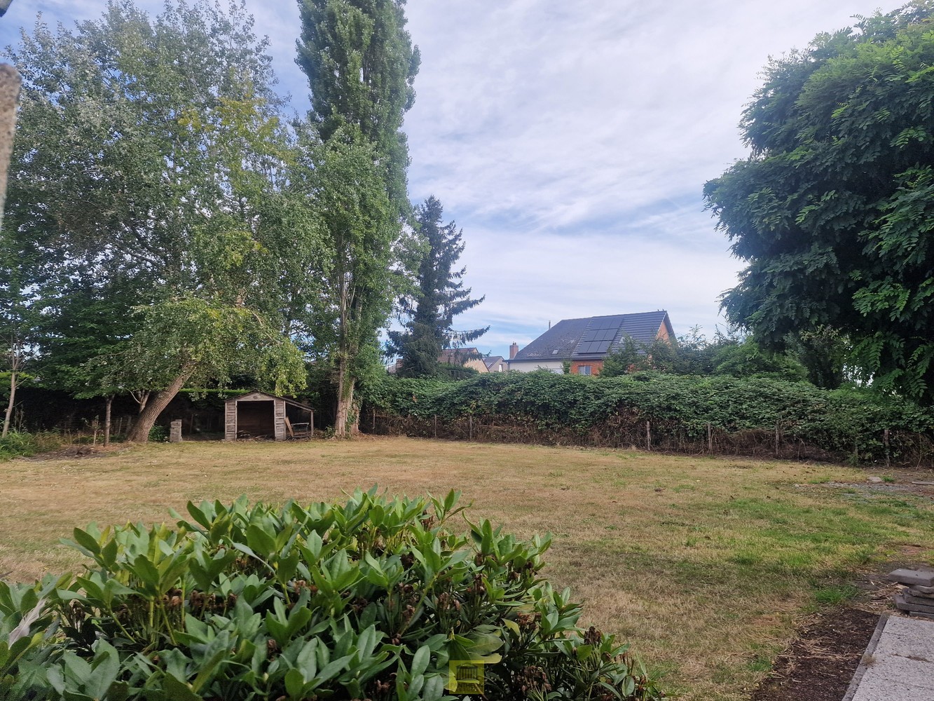 Bouwgrond voor open bebouwing met tevens bestaande woning en garage. - foto 4