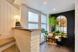 <p>This charming semi-detached end-of-row home is peacefully located at the end of a quiet dead-end street. You enter the house from the side, where the ground floor offers a practical garage, a bathroom with shower, sink and toilet, and a useful laundry corner with connections for a washing machine and dryer. From the entrance hall, stairs lead to the first floor, featuring a bright living area with dining space and an open kitchen, creating a warm and inviting atmosphere.</p>
<p>The second floor includes two bedrooms, a third room currently used as a dressing, and a second bathroom with bathtub, sink and toilet. The fully converted attic above serves as an additional spacious bedroom, surrounded by built-in cupboards for optimal storage.</p>
<p>Outside, you can enjoy the cozy terrace and the completely private garden, with no overlooking neighbours.</p>
<p>Interested? Contact We Invest Meise today at +32 2 262 45 78 to schedule a visit.</p>