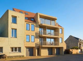 The Manu project has an excellent location along the Kerkstraat in Blankenberge. Located in the heart of this bustling seaside town, you are within walking distance of the seafront, the beach and the marina. The proximity to local shops, quality restaurants and cozy cafes makes this property the ideal base for those who love life by the sea.<br /><br />This small-scale project consists of 10 qualitative entities with a sophisticated layout:<br />- Classic apartments: Six bright apartments with two bedrooms.<br />- Studios: Two compact and functional studios, ideal as an investment or second home.<br />- Duplex apartments: Three spacious duplexes with a choice of two or three bedrooms.<br />- Private storerooms: Each entity has its own storage room on the ground floor, ideal for storing bicycles.<br />- Garages: At the rear, there are three spacious garage boxes, accessible via the Oude Steenweg.<br /><br />This new building is characterised by a unique architectural style. The building has two full-fledged facades (Kerkstraat and Oude Steenweg), both executed in a contemporary design with characteristic rounded corners and light beige brickwork. The project is also ready for the future when it comes to sustainability:<br /><br />Are you looking for new buildings for sale in Blankenberge? Contact us quickly for more info.<br /><br />Register of measures: no