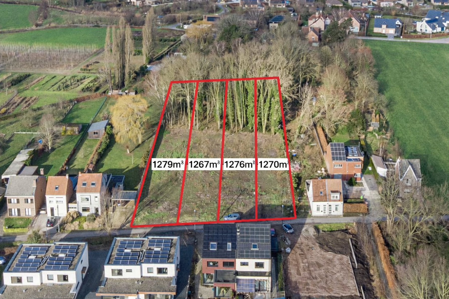 TE KOOP - bouwgrond halfopen bebouwing met stuk bos op 1270m² - foto 1