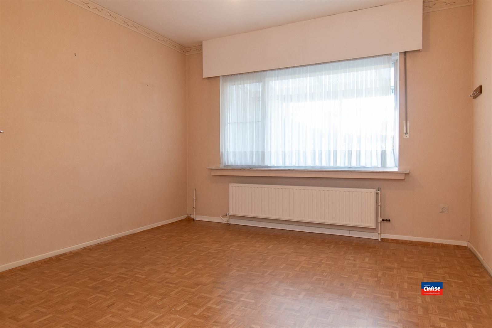 Gelijkvloersapp. met 2 slpks, tuin + garage - foto 4