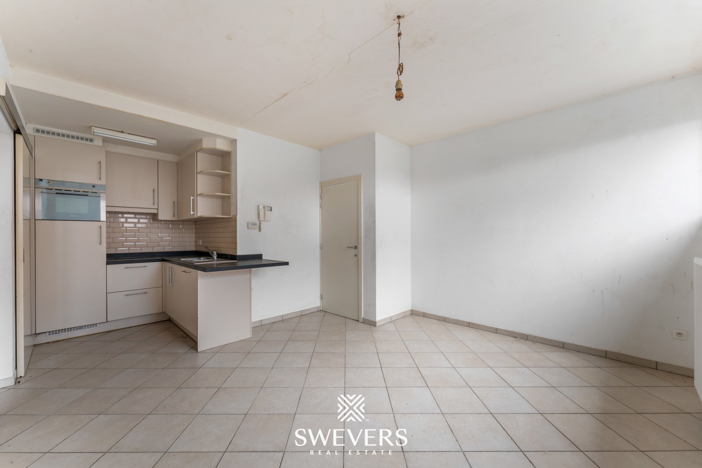 Centraal op te frissen appartement met potentieel in Halen - foto 4