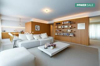 This exclusive 106 m² apartment, completely renovated under the direction of architect Emiel Vercruysse, is located on the fifth floor of a centrally located residence in Roeselare. Every detail has been worked out with the utmost care, with a focus on quality, aesthetics and comfort.When you enter, you immediately notice the high level of finish. We worked with natural stone, mortex and customization down to the smallest details. Large wooden volumes were installed in the interior that serve as functional cabinets and technical facilities. This architectural intervention brings structure and peace to the space and forms a nice contrast with the former layout full of walls.The use of colored oak creates a warm, cozy atmosphere, while the terrazzo floors and counters provide a timeless, sophisticated look. Throughout the apartment, you'll find built-in closets and smart solutions that are seamlessly integrated into the whole thing.Thanks to its location on the fifth floor, you can enjoy pleasant views, lots of privacy and no insight — a rare combination in the heart of the city. In addition, the apartment is located in the center of Roeselare, within walking distance of the Grote Markt, the shopping streets, the station and numerous cozy restaurants.