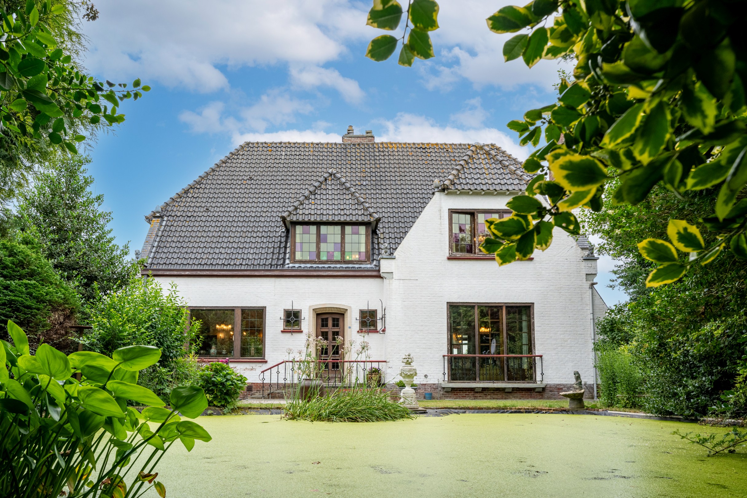 Statige jaren '50-villa met drie loodsen, uitzonderlijke privacy en eindeloze mogelijkheden - foto 3