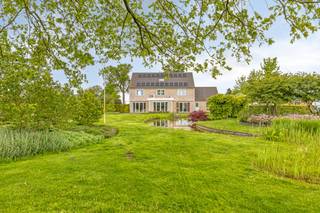 The house can be accessed through the spacious tiled entrance hall with built-in cloakroom and separate guest toilet with hand washer. Through...
