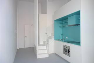 <p>Looking for a stylish, move-in-ready studio in a prime location in Leuven? This unique duplex studio on the 6th floor of Residentie Hungaria offers an exceptional combination of space, light and contemporary living comfort.<br /><br />Residentie Hungaria is a striking apartment tower on Engels Plein, right in the heart of the vibrant, revitalised neighbourhood around the Vaartkom. The building is a splendid example of modern architecture and innovative living concepts.<br /><br />The studio is situated on the quiet side of the building and is easily accessible via four lifts. Thanks to its impressive ceiling heights of up to 4.5 metres, a comfortable duplex sleeping area has been created, making optimal use of the living space. A sustainable, bespoke piece of furniture enhances this clever layout. The combination of the high ceilings and large windows also ensures exceptional natural light and a pleasant sense of space.<br /><br />Layout:<br /><br />- Entrance hall with built-in cupboards<br />- Light-filled living area<br />- Open-plan, fully fitted kitchen<br />- Duplex bedroom<br />- Bathroom with washbasin and toilet<br />- Separate storage room with connection for a washing machine<br /><br />The building also features a communal bicycle storage area in the basement.<br /><br />Available immediately.<br /><br />Rent: €900/month<br />Service charge: €50/month (communal charges and heating)<br />Electricity and water: to be arranged individually.<br /><br />Interested? Contact us on 016 23 21 45 or at verhuur@bvm-vastgoed.be <br /><br /></p>