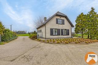 RAVELS - Landbouwwoning met bijhorende loodsen op ca 1,3 Ha.Rustig en landelijk gelegen te Ravels.Deze uitermate rustig gelegen landbouwwoning omvat...