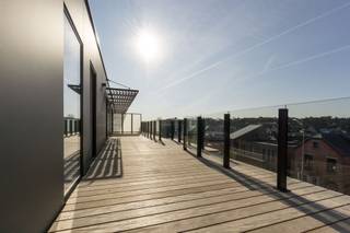 Penthouse exceptionnel dans un emplacement de choix !Surface habitable : 116 m².Ce penthouse exceptionnel offre un accès direct par l'ascenseur...