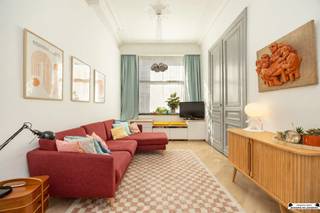 <h1><span>Beautifully renovated townhouse with a lush, private city garden</span></h1><p><span>Looking for a spacious, characterful home where authentic charm and contemporary living comfort come together beautifully? Then this renovated townhouse in </span><span>Den Dam</span><span>is </span><span> definitely worth a visit.</span></p><p><span>Behind the charming facade lies an exceptionally spacious home in which many original features have been preserved. High ceilings, original interior doors, decorative moldings, and beautiful ceiling ornaments give the home a unique character, while the renovation ensures modern comfort.</span></p><p><span>And then there’s the garden: a surprisingly lush and completely private city garden that serves as an oasis of tranquility right in the heart of Antwerp.</span></p><p><span>The home is located in the popular </span><span>Den Dam</span><span>neighborhood </span><span>, within walking distance of </span><span>Park Spoor Noord</span><span>. Shops, schools, restaurants, and public transportation are all nearby. The city center and major access roads are also easily accessible.</span></p><h3><span>Ground Floor</span></h3><p><span>As you enter through the spacious entry hall, you’re immediately greeted by the impressive ceiling height and the many authentic details that give the home its character.</span></p><p><span>Thanks to the large windows, the spacious living area enjoys a pleasant natural light. Adjacent to it is the stylish, open kitchen with a beautiful view of the green city garden. Here, living, cooking, and outdoor living come together in a particularly pleasant way.</span></p><p><span>The ground floor also features a guest restroom and access to the basement.</span></p><h3><span>First Floor</span></h3><p><span>The first floor features two spacious bedrooms and a stylish bathroom.</span></p><p><span>The bathroom is equipped with a bathtub, separate shower, double sink, and toilet. Thanks to the abundance of natural light, this is a particularly pleasant space. A practical solution for the washer and dryer has also been provided in the built-in custom cabinets.</span></p><h3><span>Second Floor</span></h3><p><span>The second floor offers a wide range of possibilities.</span></p><p><span>Currently, this floor is furnished as a second living area with a kitchen and also features a second bathroom. However, the spacious layout allows this floor to be reconfigured into </span><span>two very spacious bedrooms</span><span>, one of which has access to a rear terrace.</span></p><p><span>The second and third floors are currently rented out. If the property is sold as a whole, the lease agreement can be terminated—if desired for owner-occupancy—provided the applicable six-month notice period is observed.</span></p><h3><span>Third Floor</span></h3><p><span>The third floor features a spacious bedroom with an adjoining mezzanine that provides access to a practical storage attic.</span></p><h3><span>Green City Garden</span></h3><p><span>The absolute highlight of this home is, without a doubt, the </span><span>beautiful, green city garden</span><span>.</span></p><p><span>Right in the heart of the city, you’ll find a surprisingly spacious and completely private outdoor space where greenery, tranquility, and privacy take center stage. It’s a wonderful place to enjoy a sunny morning, long summer evenings, or cozy moments with family and friends.</span></p><p><span>A garden like this is exceptionally unique in an urban setting such as this.</span></p><h3><span>Highlights</span></h3><ul><li><span>A charming and beautifully renovated townhouse</span></li><li><span>Preservation of numerous authentic features</span></li><li><span>Surprisingly spacious home with high ceilings</span></li><li><span>4 spacious bedrooms, with the possibility of a 5th very spacious bedroom</span></li><li><span>2 bathrooms</span></li><li><span>Beautiful, green, and private city garden</span></li><li><span>Rear terrace</span></li><li><span>Very pleasant natural light</span></li><li><span>Energy-efficient with an excellent EPC rating</span></li><li><span>Code-compliant electrical system</span></li><li><span>No asbestos</span></li><li><span>Located in the Den Dam neighborhood</span></li><li><span>Within walking distance of Park Spoor Noord</span></li><li><span>Easy access to the city center and major thoroughfares</span></li></ul><h3><span>Interested?</span></h3><p><span>Are you looking for a spacious and charming home with a unique outdoor space in Antwerp? If so, we’d love to invite you to come discover this special home for yourself.</span></p><p><span>Schedule your visit today at <span>www.janssenenjanssen.be</span></span><span>.</span></p>