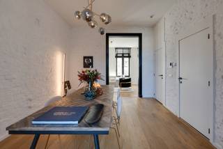 <p><strong>Characterful apartment with terrace </strong></p>
<p>Located between the vibrant streets of 't Zuid, near Marnixplaats, you will find the charming Verbondsstraat. Here, you can enjoy the ideal mix of lively city life and a quiet, characterful environment.</p>
<p>On the first floor of a small-scale building lies this characterful apartment. Upon entering, the generous windows immediately catch the eye, flooding the interior with natural light and creating a sense of space and openness.</p>
<p>Thanks to the high ceilings and exposed brick walls, the apartment exudes a warm and distinctive atmosphere. An attractive bonus is the terrace, accessible from the living area, where you can relax with a drink on beautiful days.</p>
<p>The apartment is move-in ready, featuring a fully equipped open kitchen and a modern ensuite bathroom connected to the bedroom, fitted with a stylish shower.</p>
<p>In 2020, the entire building underwent a complete renovation, ensuring modern living comfort and long-term value.</p>
<p>Finally, the apartment includes a practical private storage room in the basement, and for those wishing to move in completely worry-free, there is the option to purchase the furniture. This allows you to immediately enjoy a fully finished and stylishly furnished apartment.</p>
<p>Character, comfort, and a prime location come together in this move-in-ready apartment. An exceptional opportunity in the heart of 't Zuid.</p>
<p>Contact LISTED today for more information or a visit: +32 3 283 51 51.</p>