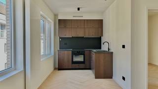 This renovated one-bedroom flat, measuring approximately 52 m², is situated on the third floor of a fully renovated apartment block in the heart...