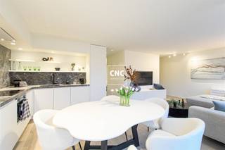 Just renovated penthouse with large sun terraces 20 meters walking distance from the seawall and beach. With side sea view!The apartment was completely renovated this year!Layout: entrance hall with guest toilet. Bright living space with open kitchen sitting area and direct access to the sun terrace (South-West orientation). Fully equipped open kitchen, two double bedrooms each with their own shower room. Large rear terrace (morning sun). All rooms have fitted wardrobes.Private cellar in the building.Need more information or want to schedule a visit? Contact Nathalie Colpaert on 0495/62 18 81 or via mail info@immocnc.be.