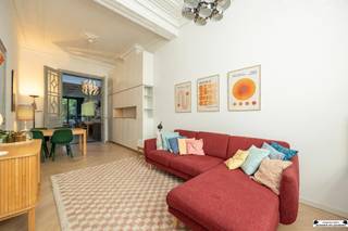 <h1><span>Beautifully renovated townhouse with a lush, private city garden</span></h1><p><span>Looking for a spacious, characterful home where authentic charm and contemporary living comfort come together beautifully? Then this renovated townhouse in </span><span>Den Dam</span><span>is </span><span> definitely worth a visit.</span></p><p><span>Behind the charming facade lies an exceptionally spacious home in which many original features have been preserved. High ceilings, original interior doors, decorative moldings, and beautiful ceiling ornaments give the home a unique character, while the renovation ensures modern comfort.</span></p><p><span>And then there’s the garden: a surprisingly lush and completely private city garden that serves as an oasis of tranquility right in the heart of Antwerp.</span></p><p><span>The home is located in the popular </span><span>Den Dam</span><span>neighborhood </span><span>, within walking distance of </span><span>Park Spoor Noord</span><span>. Shops, schools, restaurants, and public transportation are all nearby. The city center and major access roads are also easily accessible.</span></p><h3><span>Ground Floor</span></h3><p><span>As you enter through the spacious entry hall, you’re immediately greeted by the impressive ceiling height and the many authentic details that give the home its character.</span></p><p><span>Thanks to the large windows, the spacious living area enjoys a pleasant natural light. Adjacent to it is the stylish, open kitchen with a beautiful view of the green city garden. Here, living, cooking, and outdoor living come together in a particularly pleasant way.</span></p><p><span>The ground floor also features a guest restroom and access to the basement.</span></p><h3><span>First Floor</span></h3><p><span>The first floor features two spacious bedrooms and a stylish bathroom.</span></p><p><span>The bathroom is equipped with a bathtub, separate shower, double sink, and toilet. Thanks to the abundance of natural light, this is a particularly pleasant space. A practical solution for the washer and dryer has also been provided in the built-in custom cabinets.</span></p><h3><span>Second Floor</span></h3><p><span>The second floor offers a wide range of possibilities.</span></p><p><span>Currently, this floor is furnished as a second living area with a kitchen and also features a second bathroom. However, the spacious layout allows this floor to be reconfigured into </span><span>two very spacious bedrooms</span><span>, one of which has access to a rear terrace.</span></p><p><span>The second and third floors are currently rented out. If the property is sold as a whole, the lease agreement can be terminated—if desired for owner-occupancy—provided the applicable six-month notice period is observed.</span></p><h3><span>Third Floor</span></h3><p><span>The third floor features a spacious bedroom with an adjoining mezzanine that provides access to a practical storage attic.</span></p><h3><span>Green City Garden</span></h3><p><span>The absolute highlight of this home is, without a doubt, the </span><span>beautiful, green city garden</span><span>.</span></p><p><span>Right in the heart of the city, you’ll find a surprisingly spacious and completely private outdoor space where greenery, tranquility, and privacy take center stage. It’s a wonderful place to enjoy a sunny morning, long summer evenings, or cozy moments with family and friends.</span></p><p><span>A garden like this is exceptionally unique in an urban setting such as this.</span></p><h3><span>Highlights</span></h3><ul><li><span>A charming and beautifully renovated townhouse</span></li><li><span>Preservation of numerous authentic features</span></li><li><span>Surprisingly spacious home with high ceilings</span></li><li><span>4 spacious bedrooms, with the possibility of a 5th very spacious bedroom</span></li><li><span>2 bathrooms</span></li><li><span>Beautiful, green, and private city garden</span></li><li><span>Rear terrace</span></li><li><span>Very pleasant natural light</span></li><li><span>Energy-efficient with an excellent EPC rating</span></li><li><span>Code-compliant electrical system</span></li><li><span>No asbestos</span></li><li><span>Located in the Den Dam neighborhood</span></li><li><span>Within walking distance of Park Spoor Noord</span></li><li><span>Easy access to the city center and major thoroughfares</span></li></ul><h3><span>Interested?</span></h3><p><span>Are you looking for a spacious and charming home with a unique outdoor space in Antwerp? If so, we’d love to invite you to come discover this special home for yourself.</span></p><p><span>Schedule your visit today at <span>www.janssenenjanssen.be</span></span><span>.</span></p>