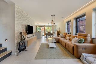 <h1><span>Spacious and energy-efficient 5-bedroom home with an E-level of -6</span></h1><p><span>Modern architecture, exceptionally energy-efficient (passive house) and surprisingly spacious! This stylish home, built in 2023, offers everything you’re looking for in contemporary family living.</span></p><p><span>This beautiful home immediately stands out for its </span><span>timeless architectural style</span><span>, combining characterful facing brick with sleek black window frames and a contemporary roofline. The architecture exudes tranquility and elegance while creating a warm, homey atmosphere. The well-maintained front yard and spacious driveway enhance the home’s modern character.</span></p><p><span>This stylish aesthetic continues inside. The home features a </span><span>spacious and light-filled living area</span><span> that flows seamlessly into the modern kitchen with a generous </span><span>kitchen island</span><span>. Thanks to the open layout, a particularly pleasant living environment is created where cooking, dining, and relaxing come together beautifully.</span></p><p><span>A major asset is the </span><span>multifunctional room on the ground floor</span><span>. It is currently set up as </span><span>an office</span><span>, but thanks to its practical layout, it can easily be converted into a </span><span>sixth bedroom</span><span>. This gives the home exceptional flexibility, making it ideal for larger families or anyone who needs an extra space for work, hobbies, or sleeping.</span></p><p><span>The upper floors feature </span><span>five full-sized bedrooms</span><span>, complemented by exceptionally comfortable bathroom facilities. The home has </span><span>two shower rooms (on the ground floor and second floor) and a spacious bathroom (on the first floor)</span><span>, ensuring ample comfort and privacy for the entire family.</span></p><h3><span>Outstanding Energy Performance</span></h3><p><span>Technically, this home also clearly stands out from traditional homes. With an </span><span>E-level of -6</span>,<span> it is exceptionally energy-efficient and fully geared toward the future.</span></p><p><span>The home is equipped with:</span></p><ul><li><span>Electric heat pump</span></li><li><span>Underfloor heating</span></li><li><span>Solar panels</span></li><li><span>Charging station for an electric car</span></li><li><span>Ventilation System D with heat recovery</span></li><li><span>Highly insulated building envelope</span></li></ul><p><span>The EPB report lists an </span><span>E-level of -6</span><span> and an annual primary energy consumption of </span><span>-11.80 kWh/m</span><span>². According to the EPB declaration, the solar panels have an estimated electricity production of </span><span>5,127 kWh per year</span><span>.</span></p><h3><span>A home with space for today and tomorrow</span></h3><p><span>With its </span><span>five bedrooms, multifunctional office/bedroom on the ground floor, spacious living area, modern kitchen, three bathrooms, and exceptional energy performance</span>,<span> this is a home that effortlessly grows with its residents.</span></p><p><span>The combination of </span><span>contemporary architecture, characterful facing brick, sleek window frames, generous spaces, and thorough energy efficiency</span><span> makes this a particularly attractive family home for those who refuse to compromise between style, comfort, and future-oriented living.</span></p><p><span>A stylish and energy-efficient new-build home that you absolutely must come and discover for yourself.</span></p><p><span>Want more information or to schedule a visit?</span><span>#NewLine #Contact us with no obligation at </span><span>011 199 991</span><span> or </span><span> lindseyswennen@janssenenjanssen.be.<br />Wij</span>—<span>we’d be happy to assist you and look forward to scheduling a visit to this beautiful home.</span></p>