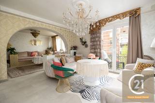 This charming and bright apartment is located in a well-maintained building in the lively Belgicastraat in Brussels. Fully move-in ready, it blends classic elegance with modern comfort, making it perfect for families or as an investment property.<br /><br />Upon entering, you are welcomed into a spacious and light-filled living area, featuring decorative ceilings, elegant chandeliers, and large windows that bring in plenty of natural light. The cosy sitting area connects seamlessly to the dining space, creating a warm and inviting atmosphere.<br /><br />The master bedroom is tastefully decorated and offers a peaceful retreat, while the two additional bedrooms can be used as children's rooms, a home office or guest rooms, depending on your needs.<br /><br />A major asset of this apartment is the practical attic, ideal for use as extra storage space – a rare advantage in an urban setting like Brussels.<br /><br />The location is excellent, within walking distance of shops, schools and public transport, and with easy access to both the city centre and the Brussels Ring.