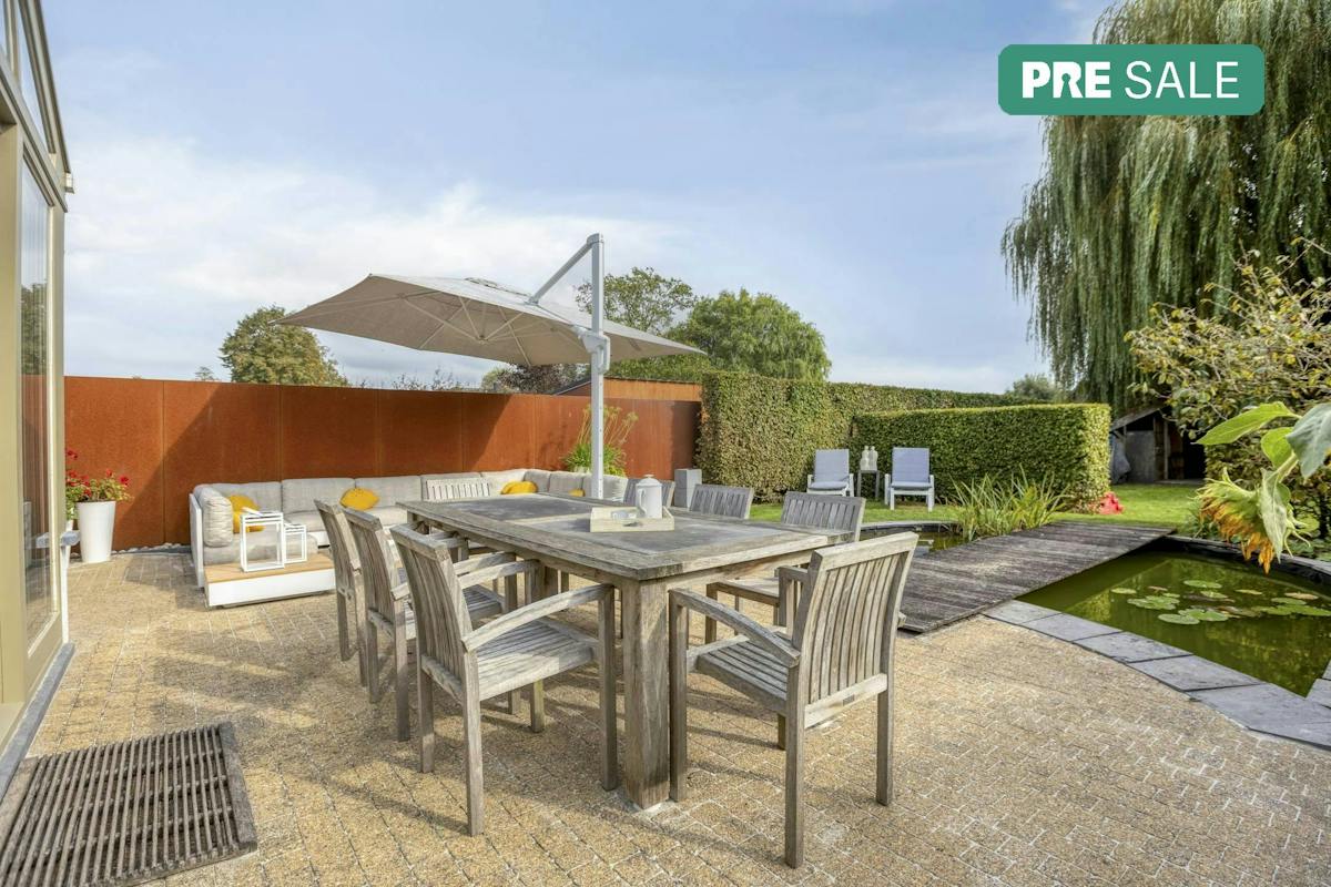 Karaktervolle woning met ruime leefruimtes en prachtige tuin - foto 1