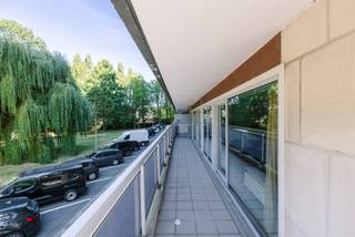<h2><span>Sint-Niklaas - Bright corner apartment with a view of greenery and two spacious terraces</span></h2><p><span>Looking for a spacious apartment in a green and sought-after location in Sint-Niklaas? This well-maintained corner apartment, located in Block 5—the newest residence in the Queen Fabiola Park—combines a practical layout, plenty of natural light, and two spacious terraces with a pleasant view of the greenery. Thanks to its excellent energy rating and peaceful surroundings, you’ll enjoy comfortable living in a pleasant residential neighborhood.</span></p><h3><span>Key features:</span></h3><ul><li><span>Move-in ready with the option for a light refresh </span></li><li><span>Two spacious terraces with a view of greenery </span></li><li><span>First floor accessible by elevator </span></li><li><span>EPC rating B (107) </span></li><li><span>Triple-pane windows </span></li><li><span>Electrical system up to code and asbestos-safe </span></li><li><span>Two private basement storage units included </span></li><li><span>Underground garage available for purchase for 25,000 euros</span></li></ul><h3><span>Layout</span></h3><p><span>The apartment is located on the first floor and is accessible by elevator. The entryway leads into the spacious and bright living area. Thanks to its corner location and large windows, you’ll enjoy plenty of natural light and a beautiful green view of the surrounding trees. From the living area, you have direct access to the spacious terraces.</span></p><p><span>The fully equipped kitchen features all necessary appliances and also opens onto the terrace, allowing you to enjoy the pleasant outdoor space at any time of day.</span></p><p><span>The apartment also features two full-sized bedrooms, a bathroom with a bathtub and sink, and a separate guest restroom.</span></p><p><span>In addition, two private basement storage units are included, ideal for extra storage space. </span></p><p><span>The location is a major asset. Queen Fabiola Park is known for its green and peaceful residential setting, while the center of Sint-Niklaas, shops, schools, public transportation, and major access roads are all within a short distance. Here, you’ll enjoy the best of both worlds: living in a green setting with all amenities within easy reach.</span></p><p><span>Are you looking for a bright apartment with two terraces in a sought-after location in Sint-Niklaas? Contact Axel Lenaerts Real Estate for more information or to schedule a viewing.</span></p><p><span>Asking price: 175,000 euros </span></p><p><span>Optional underground garage: 25,000 euros</span></p>