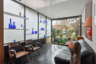 Ruime woning met 6 slaapkamers, tuin en grote werkplaats