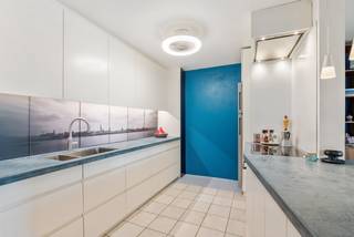 This spacious duplex apartment of 145 m² is located in a well-maintained building on the prestigious Britselei. Thanks to its residential location, you can enjoy a peaceful living environment in the middle of the city. The apartment has three bedrooms, a sunny terrace of over 20 m², and a private parking space on the ground floor.<br /><br />Situated on the prestigious Britselei, this apartment combines the best of both worlds: a central location within walking distance of shops, public transport, and restaurants, with a quiet, residential atmosphere. Additionally, it is located close to the vibrant Mechelsplein and the luxurious Botanic Sanctuary hotel. A neighborhood with real character!<br /><br />The duplex apartment is located on the fourth and fifth floors of a well-maintained building with a lift (built in 1994). With a living area of 145 m², this is an ideal home for those seeking comfort, space, and an outdoor feel in the city.<br /><br />The lift takes you directly to the entrance hall on the fourth floor. There, you enter a spacious hall that leads to the open living space, a fitted kitchen with creative accents, a guest toilet, a shower room, and an additional room currently used as a storage space. Upstairs, there are two full bedrooms — one of which is at the quiet rear side — a bathroom, a technical storage room, and a spacious terrace with views over the city. The use of parquet and natural stone provides a warm finish.<br /><br />The apartment is energy-efficient (EPC B - 167 kWh/m²), equipped with convenient built-in custom closets, and is located in a building with a lift. The parking space on the ground floor completes the picture.<br /><br />Advantages at a glance:<br />• 145 m² living area<br />• 3 bedrooms, flexible in layout<br />• Large sunny terrace of 20 m² with city views<br />• Kitchen with smart layout and creative accents<br />• Parquet and natural stone for a high-quality finish<br />• Energy-efficient: EPC label B (167 kWh/m²)<br />• Quiet, residential location in the city center<br />• Private parking space available for purchase for €15,000<br />• Well-maintained building with a lift (built in 1994)<br />• Within walking distance of Mechelsplein and Botanic Sanctuary<br /><br />This duplex apartment combines an excellent location with a smart layout, comfort, and a beautiful terrace. An ideal city home for those seeking space and tranquility in the heart of Antwerp.