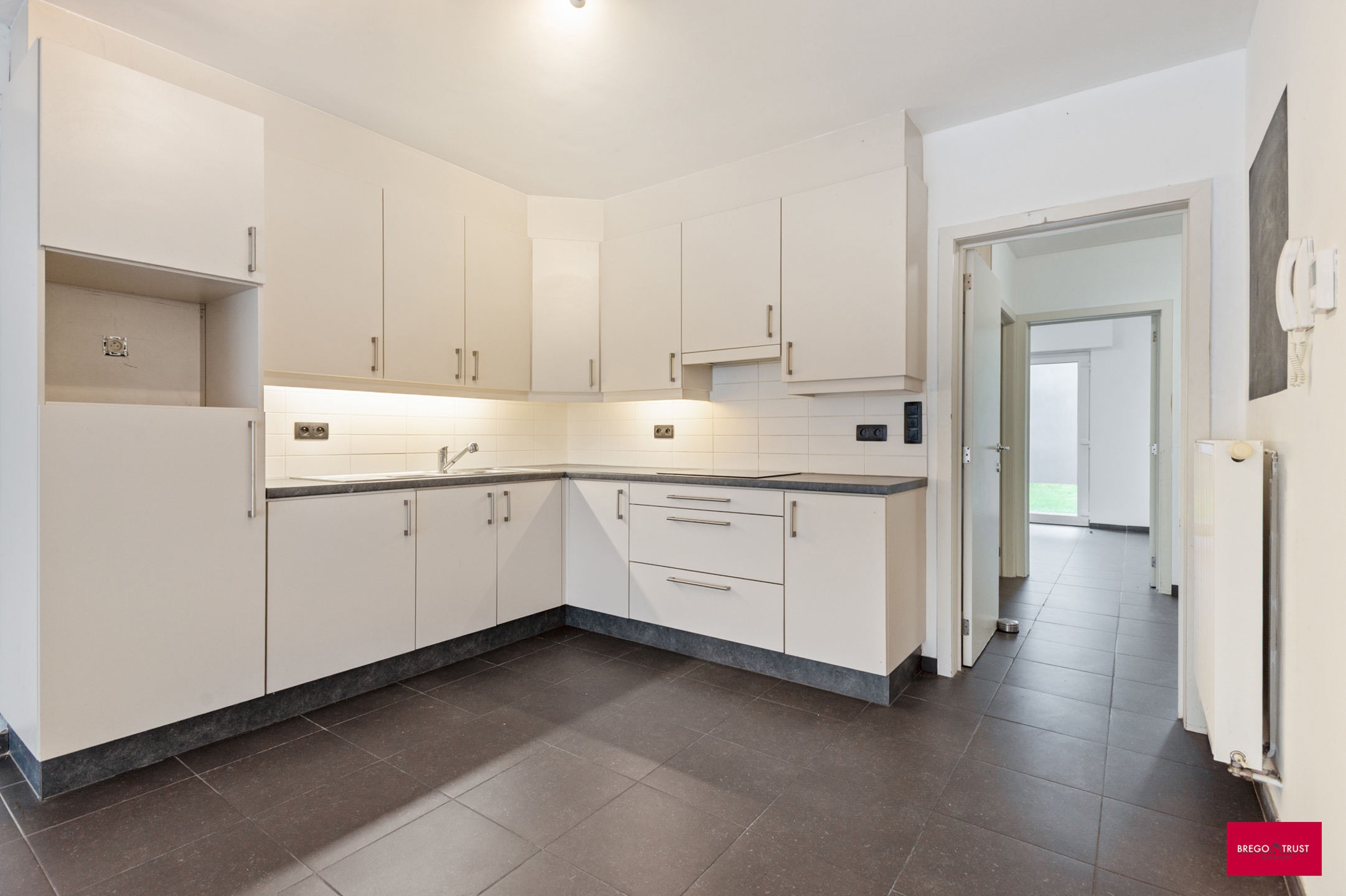 Gelijkvloersapp met 2 slpk en tuin. - foto 5