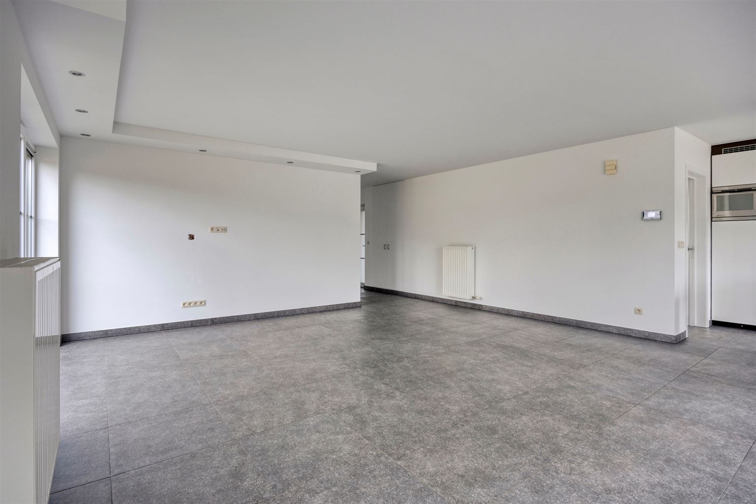 Instapklaar gelijkvloers appartement met 2 slaapkamers, ruime tuin en parkeergelegenheid op een rustige toplocatie in Opitter.  - foto 4