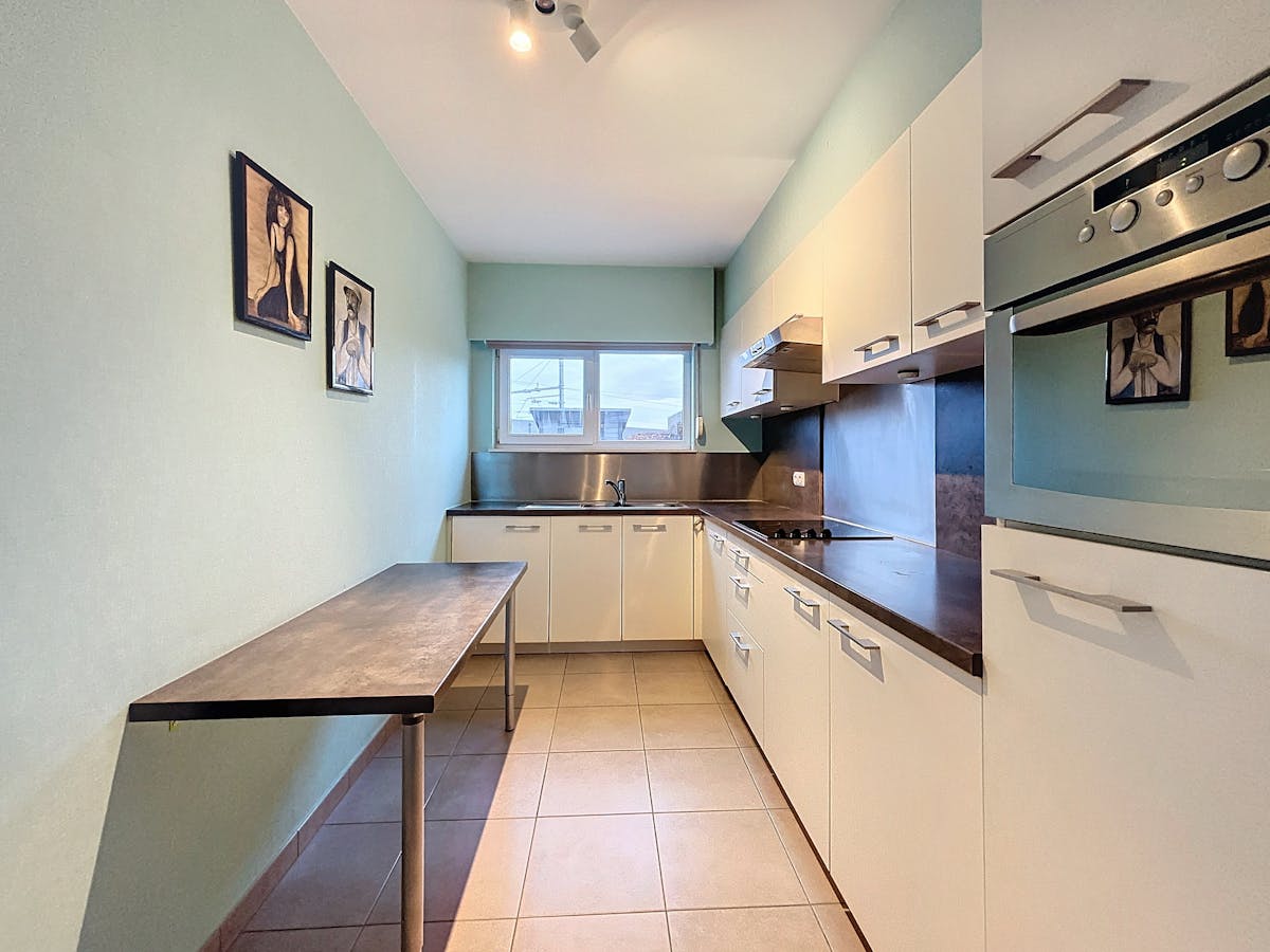 Gelijkvloers appartement met 2 slaapkamers en garagebox! - foto 4