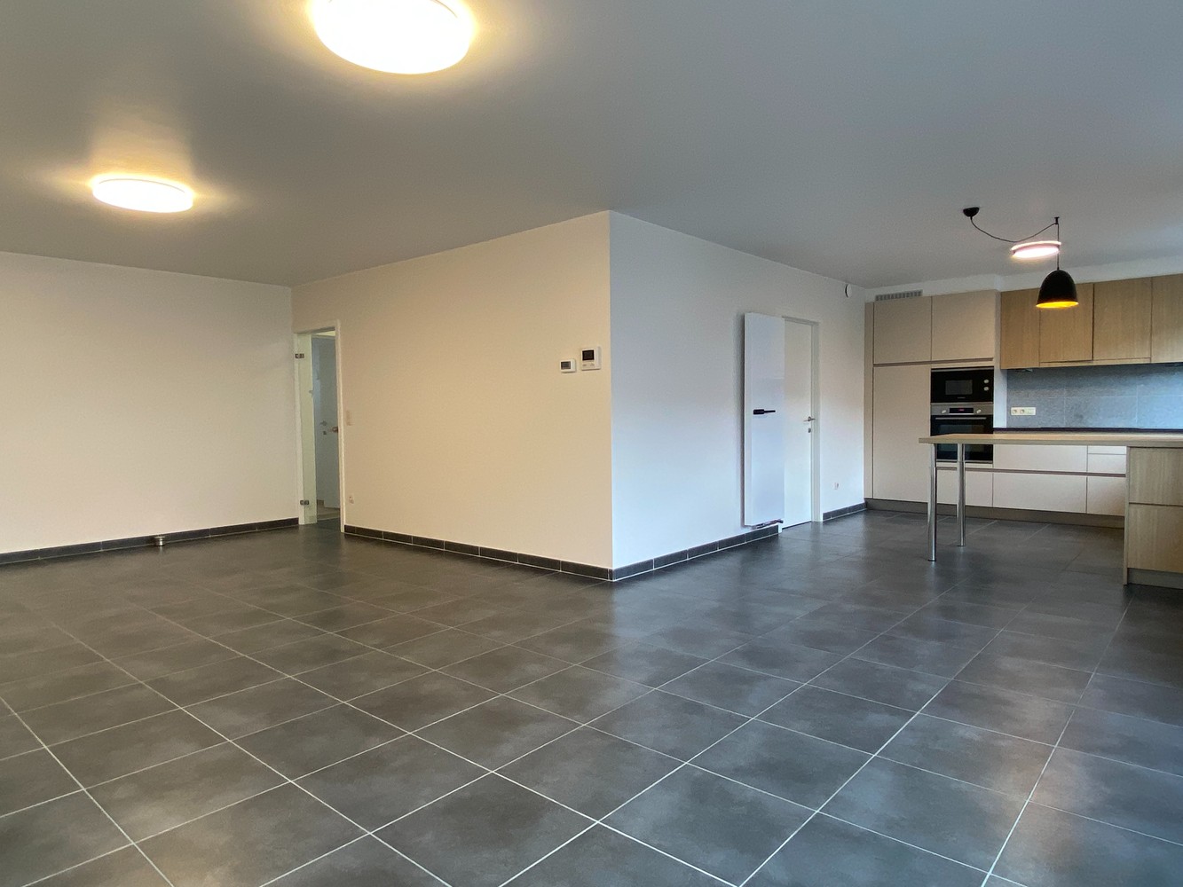 Rustig gelegen appartement met 2 slaapkamers, ruim zonneterras en autostaanplaats te centrum Tienen - foto 4