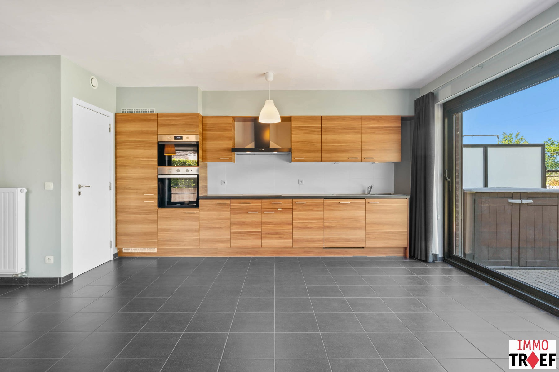 Energiezuinig gelijkvloers appartement met tuin & garagebox - foto 5