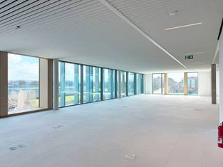 <p>The Hubert — surfaces from 200m²</p>
<ul>
<li>Location: Prime spot at the E40 exit — excellent connectivity</li>
<li>Layout: 3 interconnected buildings, single-level floor plates up to 3,335 m²</li>
<li>Flexibility: High-efficiency partitioning, adaptable to diverse tenant needs</li>
<li>Natural light: Abundant throughout, with very large windows for maximum daylight</li>
<li>Outdoor space: Extensive green areas, plus private terraces and shared/common terraces</li>
<li>Ground-floor hub: Professional meeting facilities, communal cafeteria, common meeting rooms, lounge area</li>
<li>Facilities: Showers and lockers available</li>
<li>Accessibility: Fully accessible for people with reduced mobility</li>
</ul>