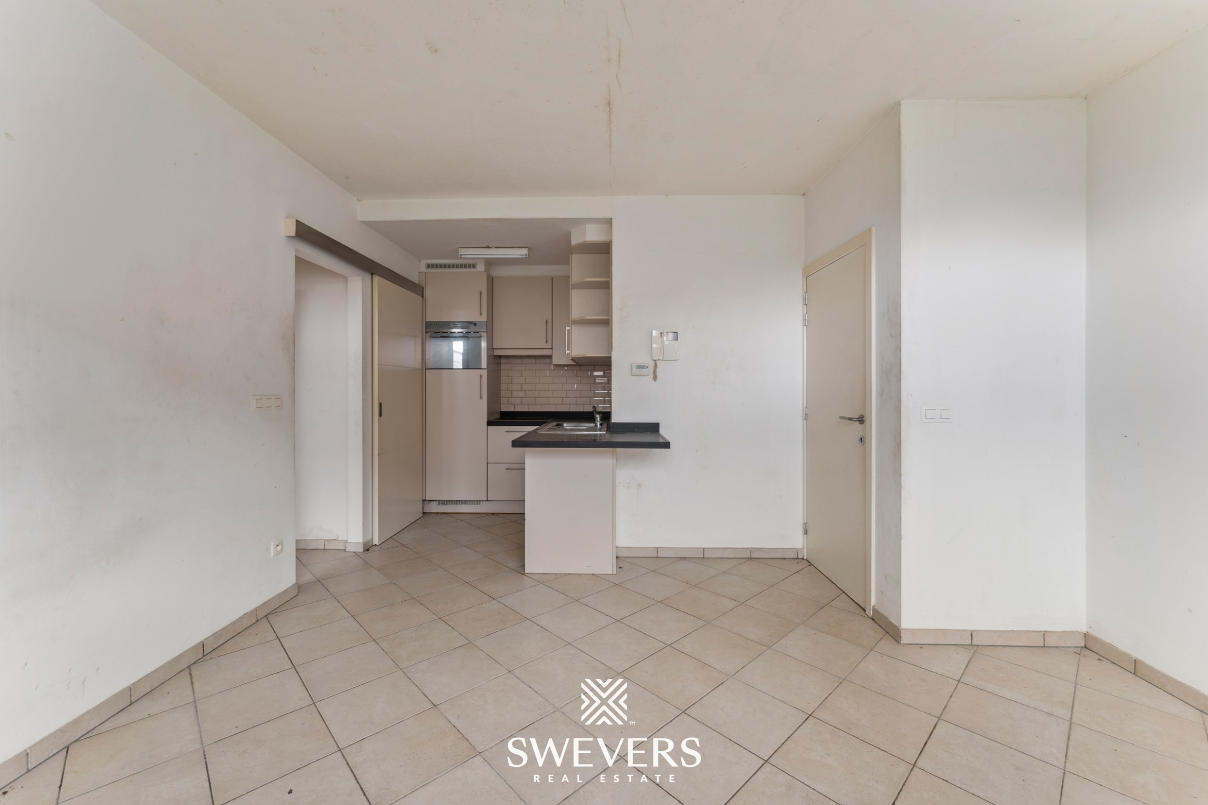 Centraal op te frissen appartement met potentieel in Halen - foto 4