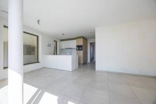 Discover this <strong>recently</strong> <strong>completed</strong> <strong>and</strong> <strong>move-in ready</strong> <strong>new build apartment</strong> in the stylish <strong>Residence</strong> <strong>Odrada</strong>, superbly located on Westendelaan in Middelkerke. Thanks to its tranquil location, within walking distance of the beach, the new casino, shops, restaurants, and public transport, you will enjoy a perfect combination of comfort, peace, and a vibrant coastal atmosphere.<br /><br />This bright apartment of <strong>78 m²</strong>, situated on the <strong>first</strong> <strong>floor</strong>, has been finished with high-quality materials and a contemporary design. The spacious living area with large windows is bathed in natural light and opens directly to the pleasant terrace, where you can enjoy the open view in peace.<br /><br />The <strong>fully equipped open kitchen</strong> features all modern appliances and seamlessly connects to the living area, making it ideal for cozy moments with family or friends. Furthermore, the apartment includes two full-sized bedrooms, a stylish bathroom with <strong>walk-in shower and double sink</strong>, a separate guest toilet, and <strong>a practical storage area</strong>, ensuring extra storage space and optimal living comfort.<br /><br />The residence also offers a <strong>communal</strong> <strong>bicycle storage</strong> and, thanks to the excellent <strong>EPC label A</strong>, you will live here in a particularly energy-efficient and future-oriented way.<br /><br />Whether you are looking for a <strong>permanent residence, a second home by the sea, or a profitable investment</strong>, this apartment provides all the advantages to meet your expectations. The sale takes place under the <strong>21% VAT regime</strong>, but if you meet the legal requirements, you can benefit from the <strong>reduced VAT rate of 6%.</strong><br /><br /><u>The purchase of an underground parking space is mandatory and costs € 35,000 excluding fees.</u><br /><br /><strong>Highlights</strong>
<ul>
<li>New build</li>
<li>2 bedrooms</li>
<li>EPC A</li>
<li>Prime location</li>
<li>6% VAT possible</li>
</ul>
Interested in this qualitatively finished new build apartment in a prime location on the Belgian coast? Contact us today for a visit and discover the comfort, space, and excellent location of this unique living opportunity.