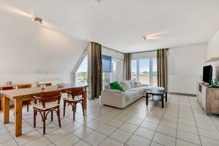 Looking for a centrally located penthouse for sale in Roeselare? Then this pleasant and bright corner apartment in the Prinsenhof residence is definitely something for you. This apartment is located in a strategic location in Roeselare, near the station and within walking distance of shops, schools and restaurants. Ideal for those who want to live centrally or are looking for an interesting real estate investment.<br /><br />Layout of the attic apartment for sale:<br /><br />entrance hall with separate guest toilet | spacious, bright living room with adjoining terrace | open kitchen | storage | bathroom with bath and double washbasin | two bedrooms<br /><br />Advantages of this apartment for sale in Roeselare:<br /><br />- centrally located, within walking distance of Roeselare station<br />- ready to move in and well maintained<br />- favourable EPC and blank electrical inspection<br />- bright roof apartment with pleasant terrace<br /><br />Possibility to purchase a garage box (25,000 euro) on the domain.<br /><br />This apartment for sale in Roeselare is suitable for private use or as an investment. Whether you're a starter, commuter, or investor, you should definitely come and see this apartment. Moreover, as a city, Roeselare offers an excellent combination of living, shopping and relaxing in the center of West Flanders.<br /><br />Register of measures: no