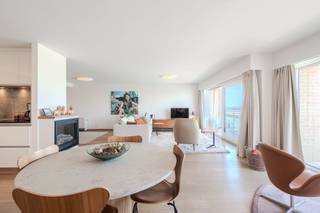 Looking for a ready-to-move-in apartment with a beautiful view of the sea and the harbour channel? This bright two-bedroom apartment is located on the fifth floor and has no less than three terraces. The apartment was built in 1990 and renovated in 2019. Thanks to its spacious living space, high-quality finish and excellent light, you will enjoy pleasant living comfort.<br /><br />The living space of no less than 41 m² consists of a cozy sitting area, dining area and a spacious 11 m² open kitchen. From the living area, you have access to two terraces. The third terrace is accessible from the bedroom. The installed kitchen has a Miele oven, induction hob, refrigerator, freezer and dishwasher. The apartment also has a private basement with a connection for a washing machine and dryer.<br /><br />Layout:<br /><br />Entrance hall<br />Bright living space with dining area and open kitchen<br />Two terraces adjacent to the living space<br />Bedroom 1 with access to the third terrace<br />Bedroom 2<br />Bathroom<br />Separate toilet<br />Storage<br />Private basement storage<br /><br />Advantages:<br /><br />Beautiful view of the sea and the harbour channel<br />Three terraces<br />Spacious living space of 41 m²<br />11 m² open kitchen<br />Renovated in 2019<br />Ready to move in<br />Parquet floor<br />Possibility to purchase a spacious garage box of 26 m²<br /><br />Are you looking for a ready-to-move-in apartment with two bedrooms, spacious terraces and a beautiful view of the sea and the harbour channel? Don't hesitate to contact us for more information or a visit!<br /><br />Register of measures: no