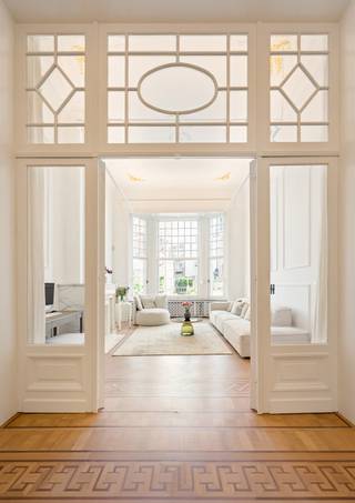 <p>Located in the <strong>highly sought-after and prestigious Markgrave district</strong>, this beautiful and exceptionally bright townhouse combines <strong>timeless character with contemporary comfort</strong>. The property has been fully renovated with great respect for its original features and finished with high-quality, durable materials.</p>
<p>The elegant marble entrance hall leads to a generous living floor comprising <strong>three interconnected reception rooms</strong>, featuring high ceilings, beautiful parquet flooring and authentic marble fireplaces. At the rear of the house, a modern fully equipped kitchen opens onto a <strong>15 m² terrace and a lovely private garden</strong>, surrounded by mature trees that provide a wonderful sense of peace and privacy.</p>
<p>The property offers <strong>four spacious bedrooms and several bathrooms</strong>. The garden-facing bedroom benefits from its own terrace and en-suite bathroom. The top floor is arranged as a <strong>fully equipped studio</strong> with kitchen, sleeping area and bathroom, making it ideal as a guest suite, home office or additional living space.</p>
<p>Particular attention has been paid to the renovation and finishing, with beautifully restored original details, elegant paintwork, parquet floors, high ceilings and refined touches including <strong>gold-leaf detailing</strong>.</p>
<p>A major advantage is the <strong>exceptionally spacious underground parking area of approximately 64 m²</strong>, complemented by parking directly in front of the property. Air conditioning is installed on the second and third floors.</p>
<p><strong>A rare opportunity to acquire a characterful townhouse with a private garden and generous parking in one of Antwerp’s most desirable residential neighbourhoods — combining elegance, space, privacy and modern comfort.</strong></p>