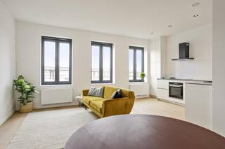 Wonen in een dynamische buurt in volle ontwikkeling kan nu in dit volledig vernieuwd appartement met één slaapkamer.Indeling:Uniek gelegen...