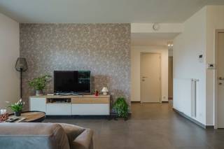 This cozy apartment in Heule excels in comfort and, as an extra bonus, has a beautiful, private garden.<br /><br />The apartment is currently set up as a nail salon. To give you a perfect picture of the space as a cozy dining and living space, the photos used are of the identical apartment above. The large cabinet in the living room is still being removed, and the black frame in the kitchen can also be removed as desired.<br /><br />The posted price includes the apartment, the garden and two aboveground parking spaces.<br /><br />You enter the bright living room with an open kitchen, which offers direct access to the terrace and garden. In addition, the apartment has a comfortable bedroom, a bathroom, a separate toilet and a practical laundry room. The apartment is equipped with air conditioning, fly screens and electric darkening that you can easily control remotely via your smartphone.<br /><br />Plan your visit quickly and contact Michelle:<br />0493 25 46 81<br />michelle.decoutere@dewaele.com<br /><br />Register of measures: no